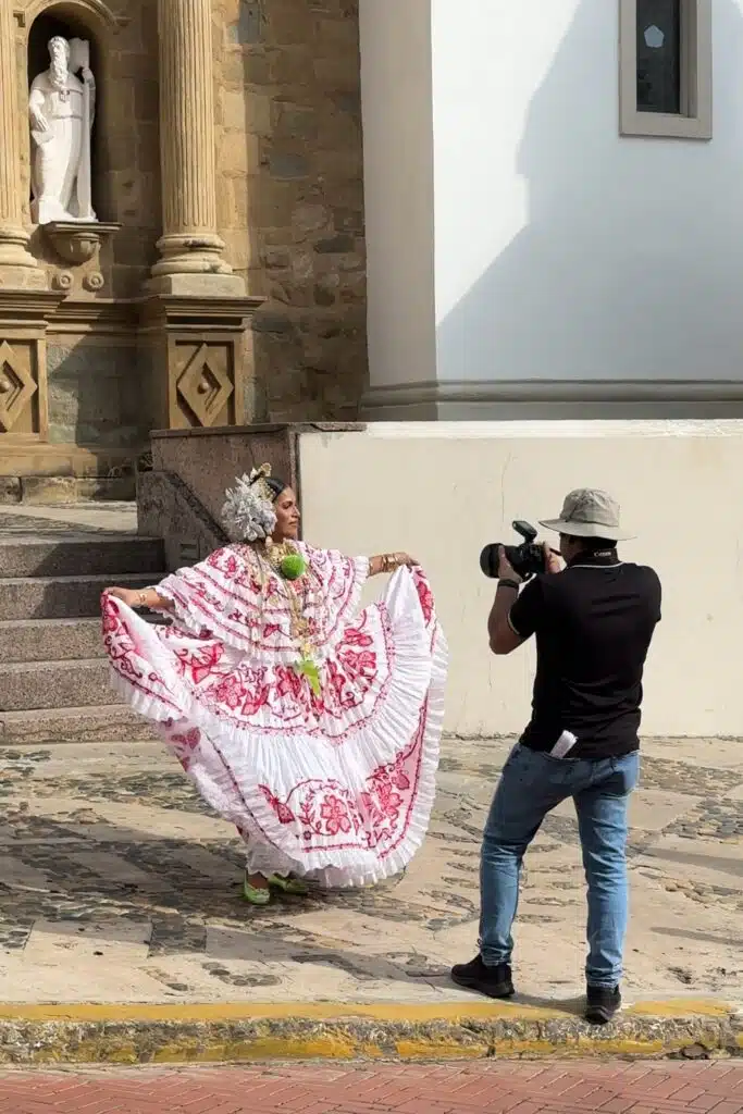 Photos being taken of a woman in a pollera traditional Panamanian dress