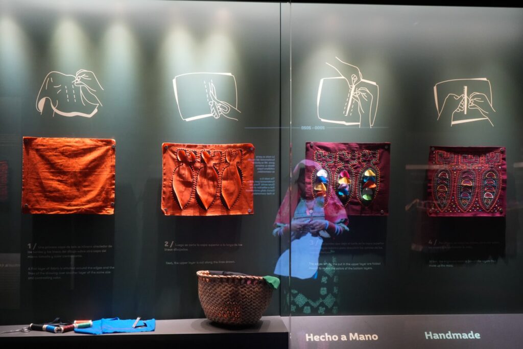 Display portraying the layers and steps involved in making one mola in a museum in Panama City