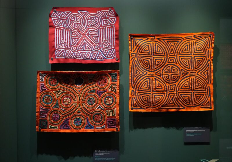 Three mola designs on display at Mola Museum in Casco Viejo Panama