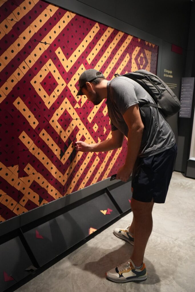 Man completing the mola mosaic at Mola Museum in Panama City