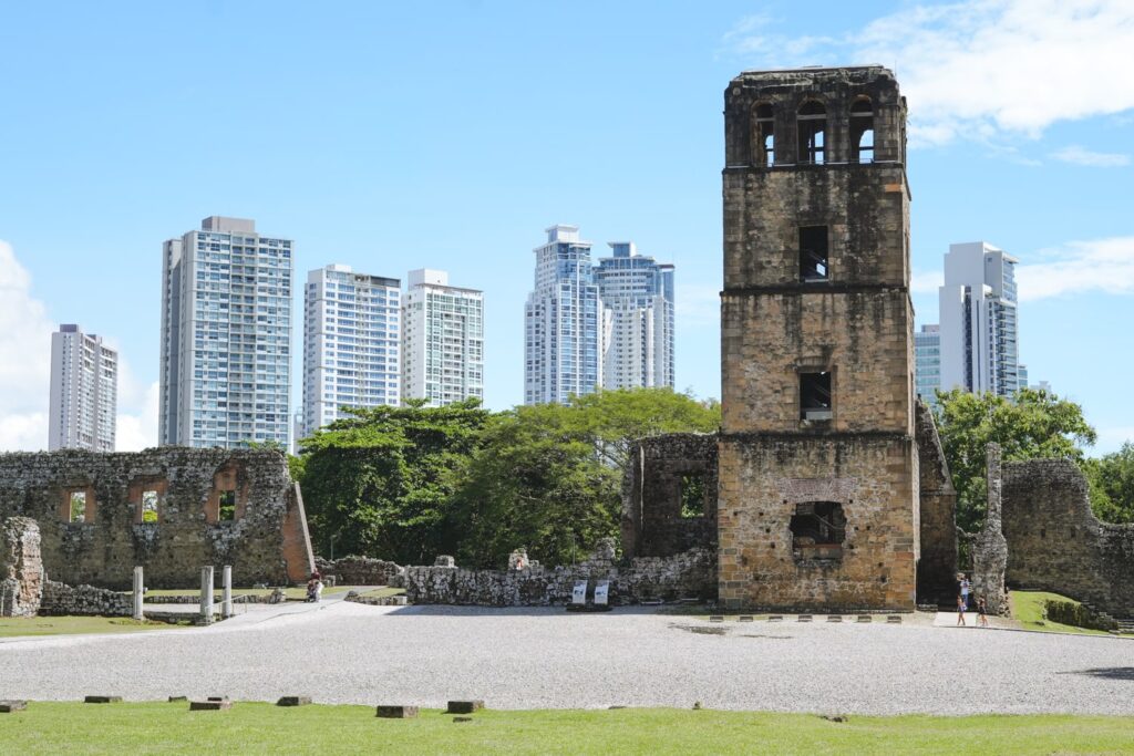 View of Panama Viejo historic museum in Panama City backed by modern skyscrapers