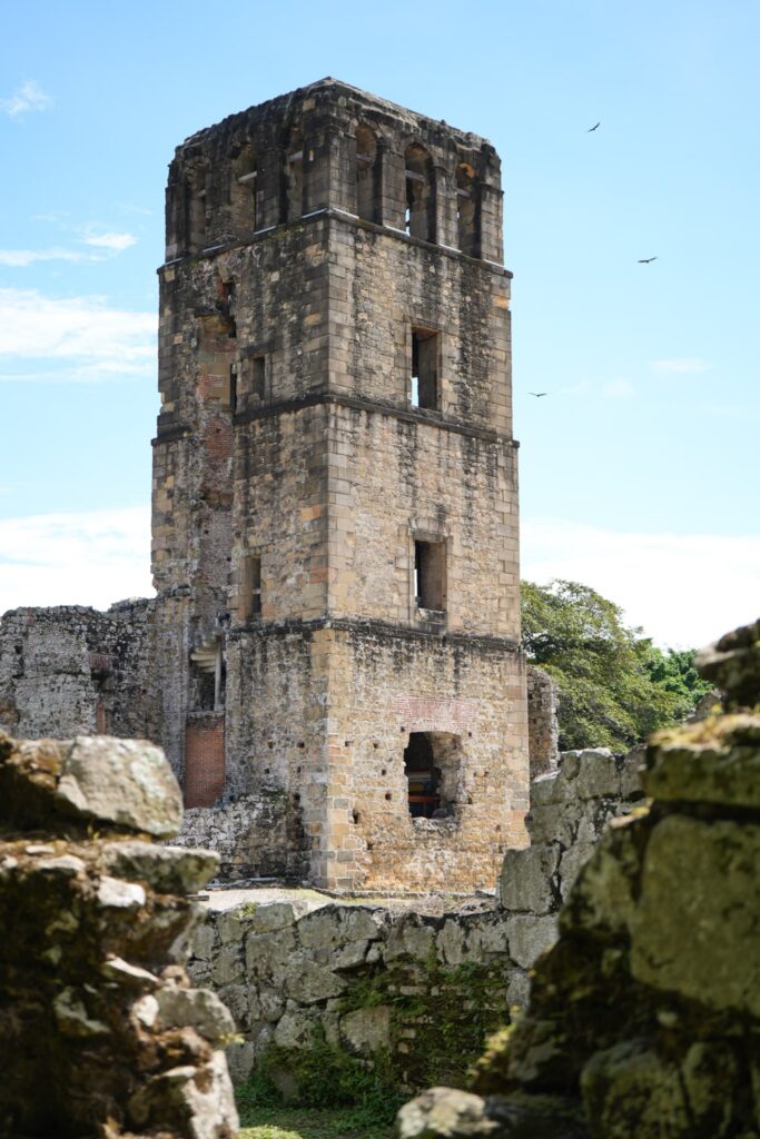 Panama Viejo Tower with birds flying around it