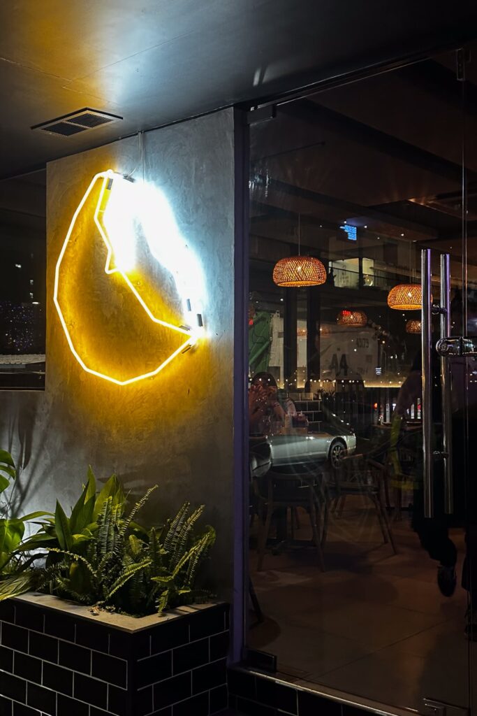 Neon sign at the entrance to Tapa del Coco restaurant in Panama City