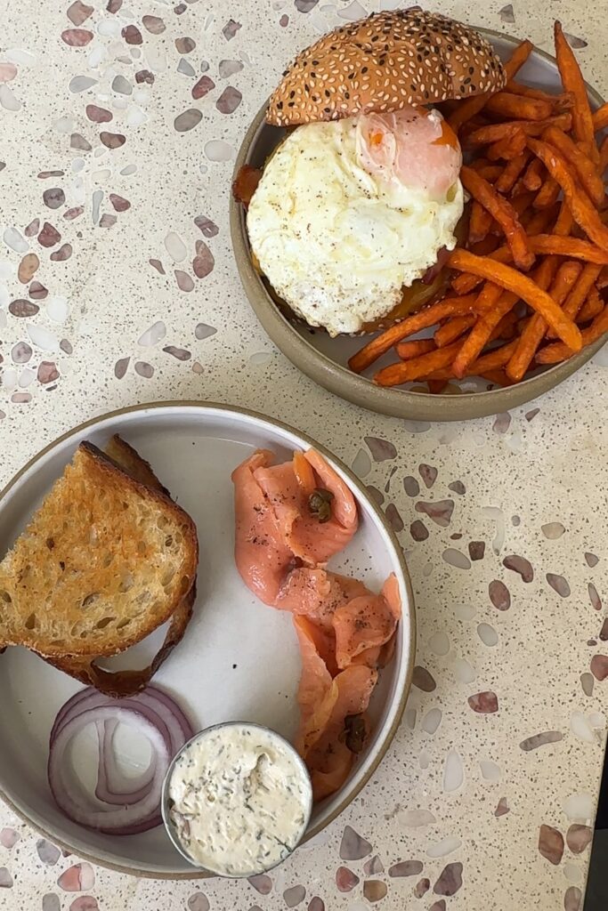 salmon toast and breakfast burger for brunch at a cafe in panama city
