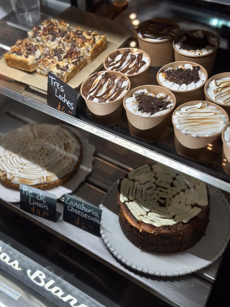 Tres leches and other desserts on display in a cafe