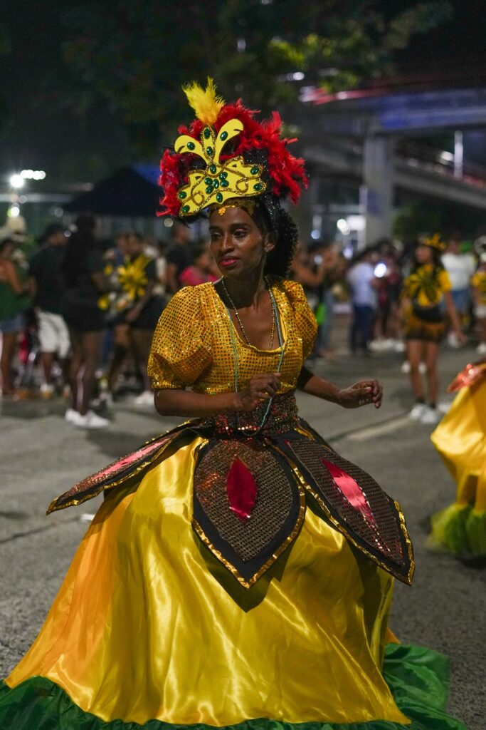 Woman in a colorful dress dancing at carnaval in Panama