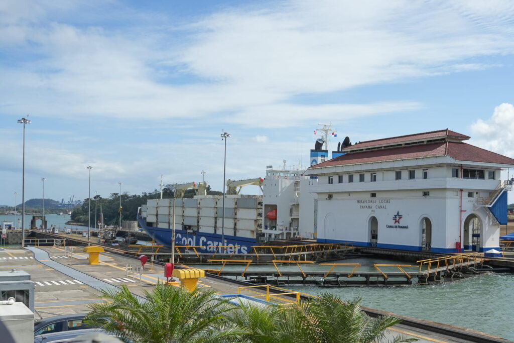 miraflores locks at panama canal and ship passing
