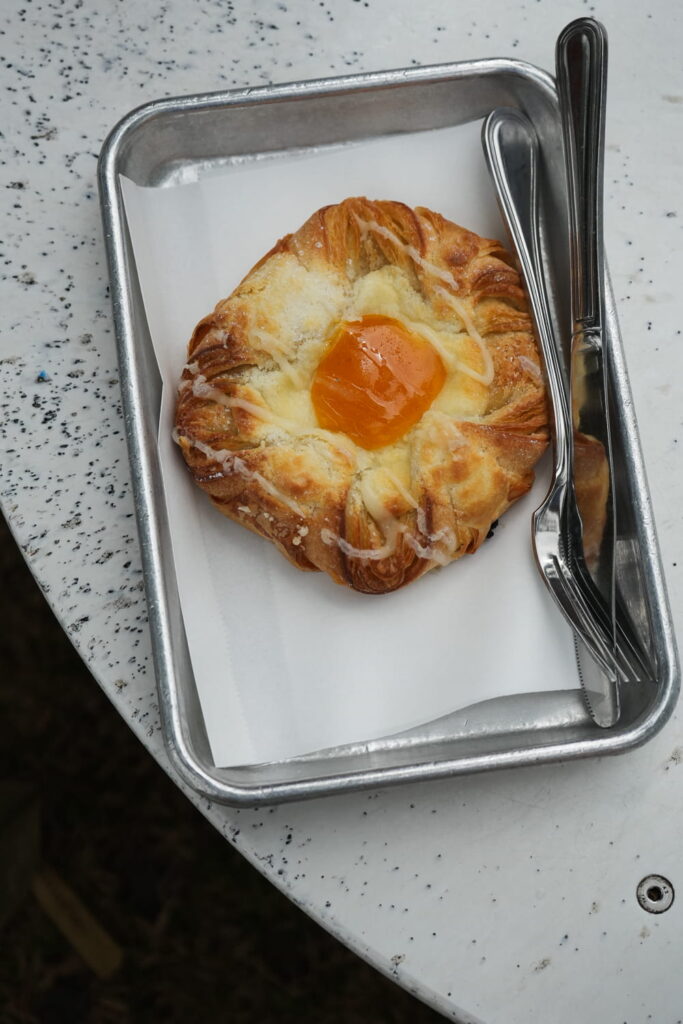 pastry with passionfruit gel center and white chocolate drizzle